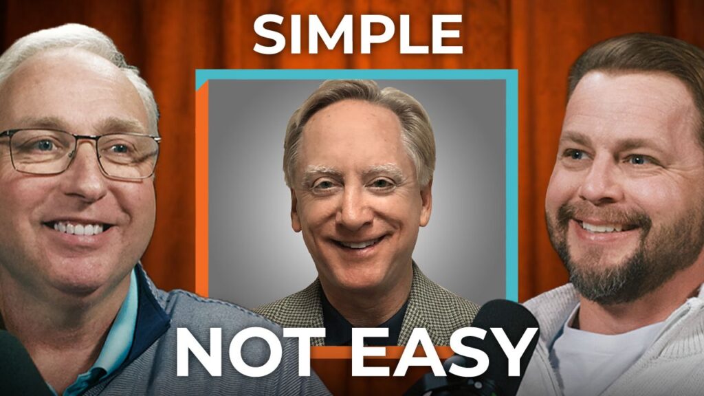 Paul Kelly and two smiling men sit at microphones with "Simple Not Easy" above and below, showing the service giant’s company culture.