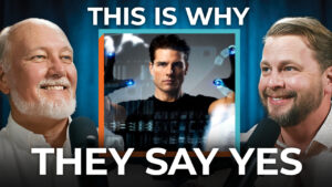 Two men speak into microphones with a futuristic movie scene between them and bold text saying "THIS IS WHY THEY SAY YES," revealing sales psychology.