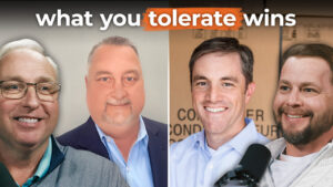 Four smiling men in business attire stand below the text "what you tolerate wins," showing how culture drives business growth.