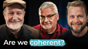 Three smiling men look at the camera. “Are we coherent?” appears below, questioning if the marketing strategy is working or broken.